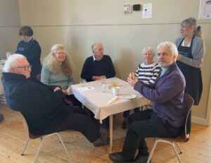 A group of people eating breakfast at a table